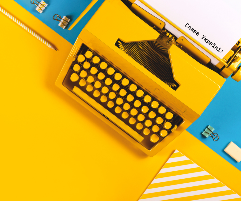 This is an image of a typewriter symbolizing writing and authorship. Slava Ukraini, or Glory to Ukraine, is written by the typewriter to represent Ukrainian authorship and and support for Ukraine in the current war.